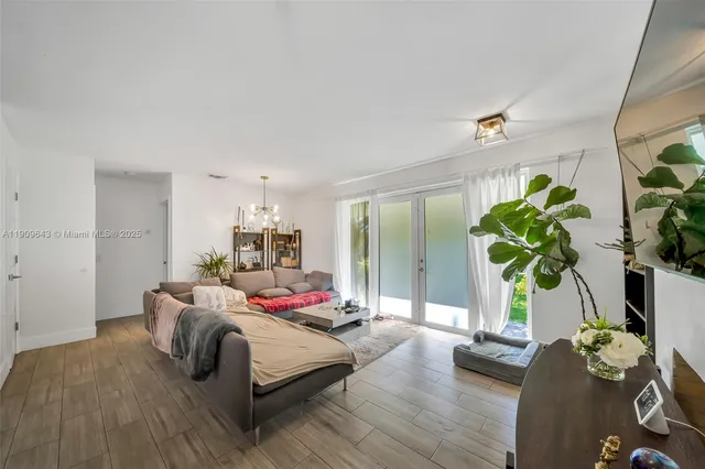 a bedroom with furniture and a potted plant