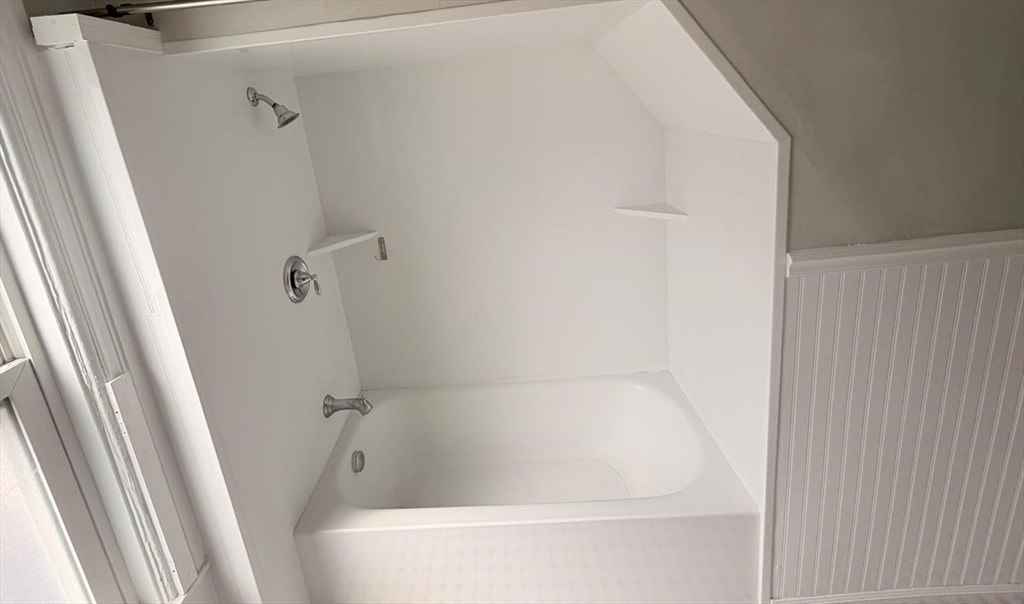 465 High Street, Unit 2 Dedham, MA 02026 - Photo 6 of 12 a bathroom with a bathtub