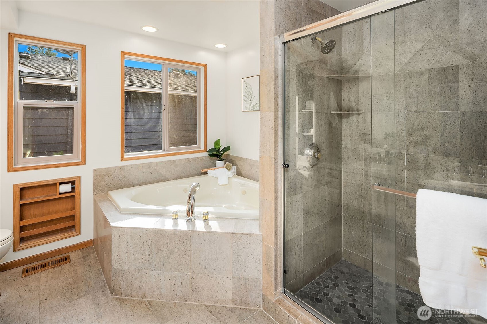 1718 128th Avenue Southeast Bellevue, WA 98005 - Photo 17 of 40 a bathroom with a bathtub and a shower