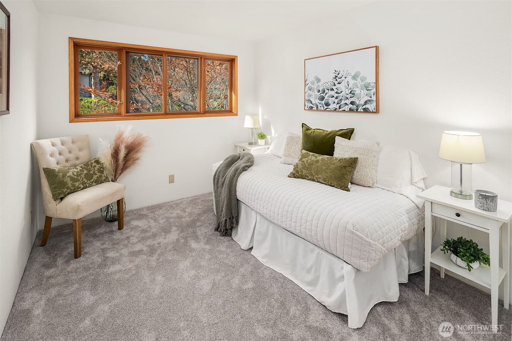 1718 128th Avenue Southeast Bellevue, WA 98005 - Photo 19 of 40 a bedroom with a bed and a painting on the wall