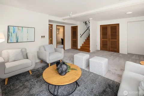 a living room with furniture and a rug