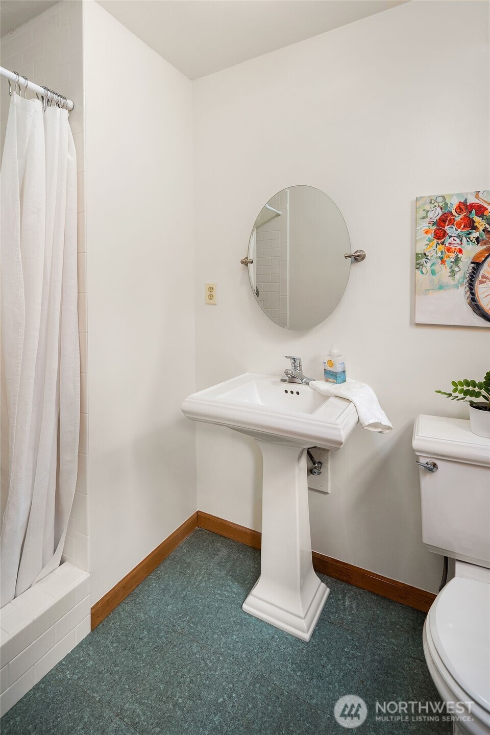 1718 128th Avenue Southeast Bellevue, WA 98005 - Photo 24 of 40 a bathroom with a sink toilet and a mirror