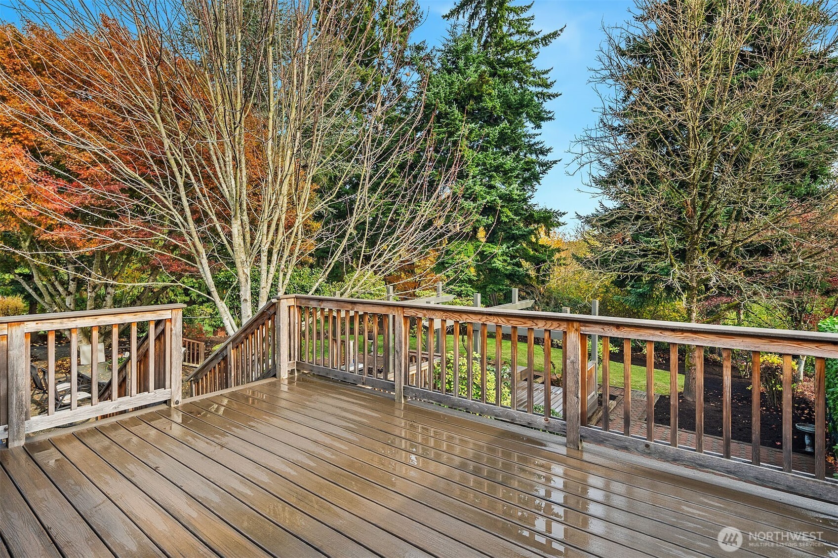 1718 128th Avenue Southeast Bellevue, WA 98005 - Photo 30 of 40 a balcony with wooden floor and fence