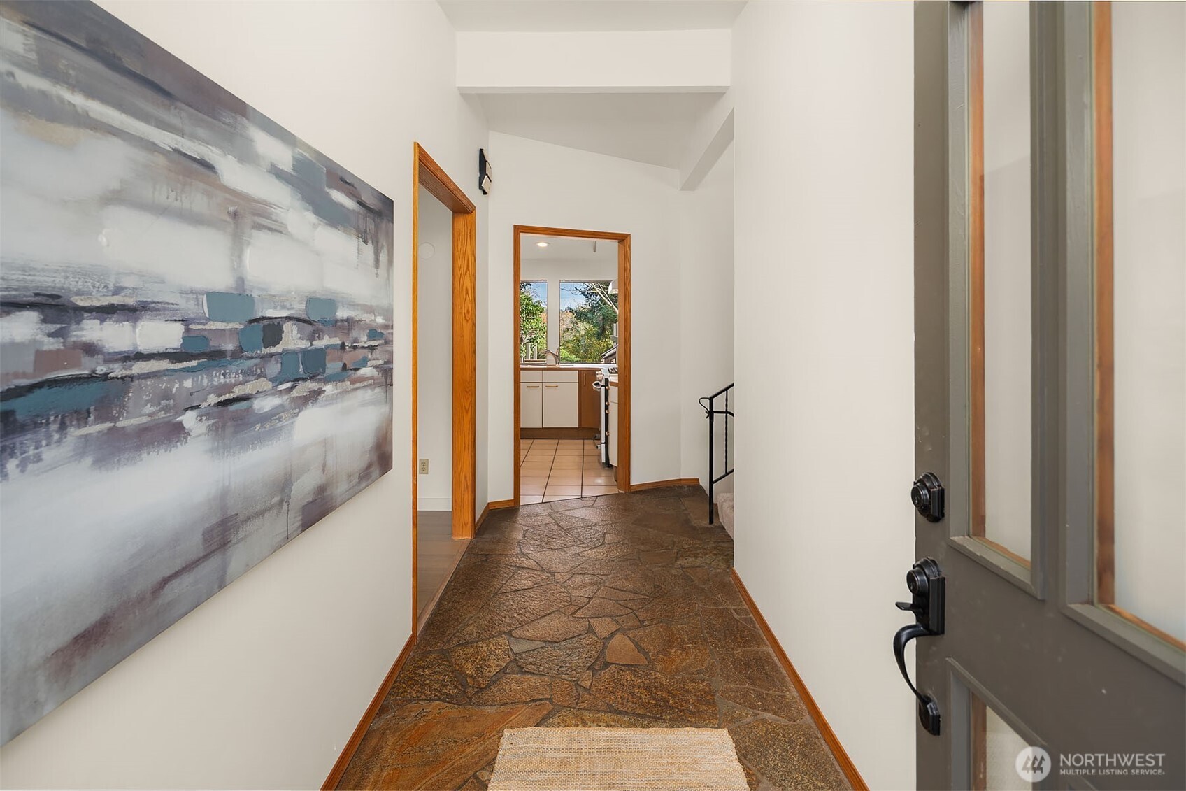 1718 128th Avenue Southeast Bellevue, WA 98005 - Photo 3 of 40 a view of a hallway with a dining area