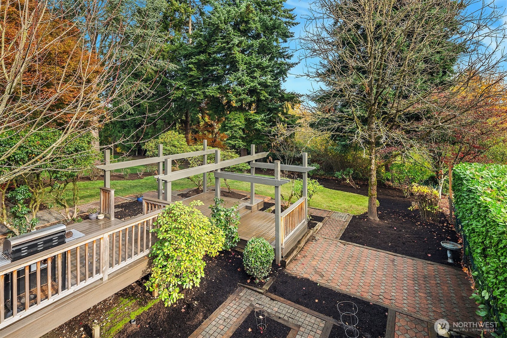 1718 128th Avenue Southeast Bellevue, WA 98005 - Photo 31 of 40 a view of a chair and tables front of the house