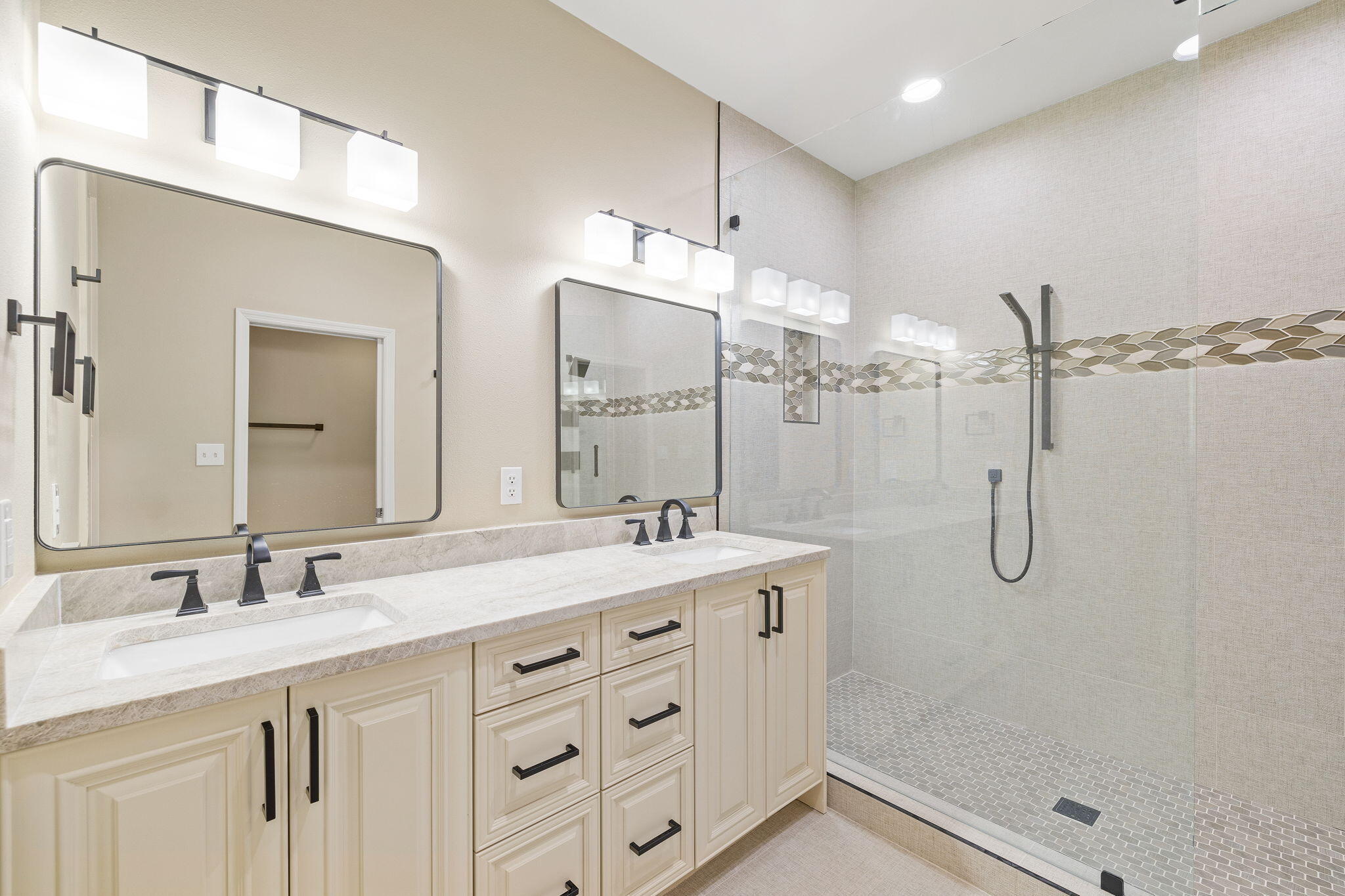969 Northshore Drive Miramar Beach, FL 32550 - Photo 26 of 87 a bathroom with a double vanity sink mirror and shower