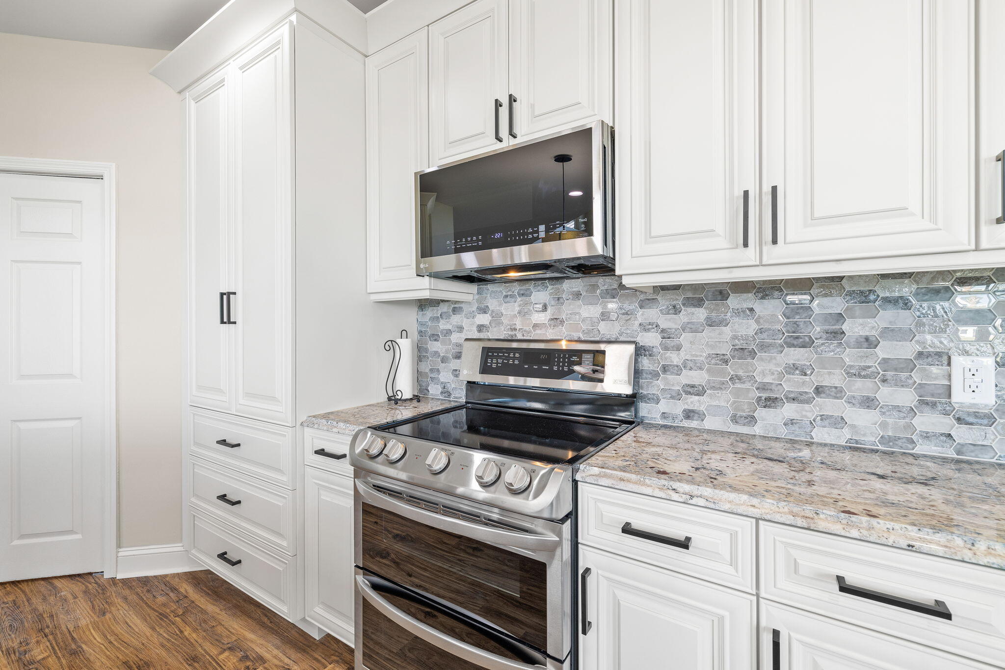 969 Northshore Drive Miramar Beach, FL 32550 - Photo 10 of 87 a kitchen with white cabinets and appliances