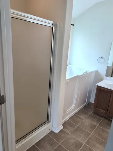 an empty room with a wooden door