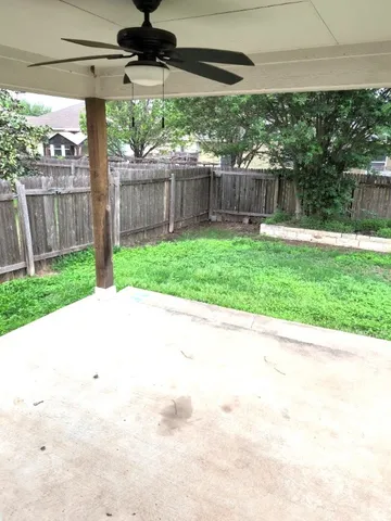 a view of house with yard