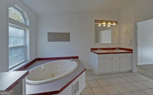 a bathroom with a bathtub and a sink