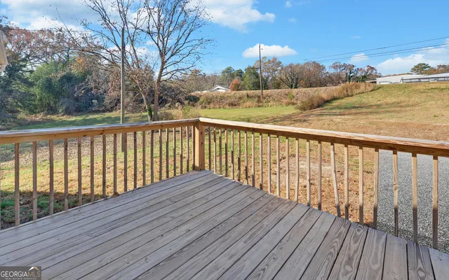 a view of balcony with wooden floor