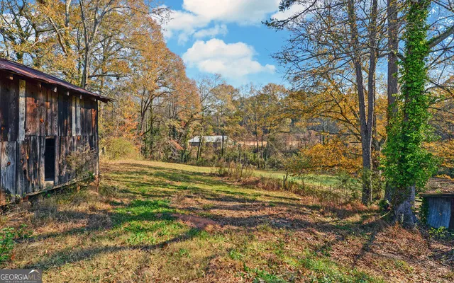 a view of a backyard of the house