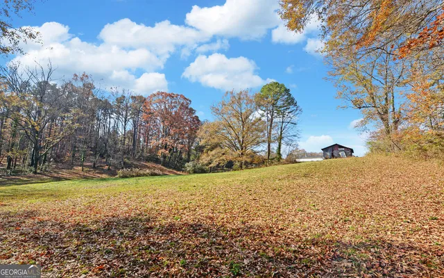a view of a golf course with a lake