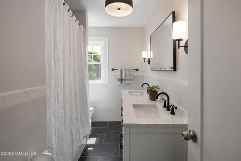 a view of a hallway with windows