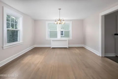 a dining room with furniture window wooden floor