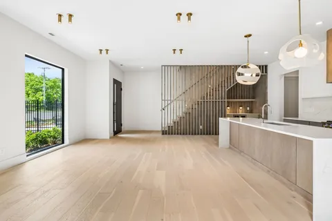 a very nice looking kitchen with a large window