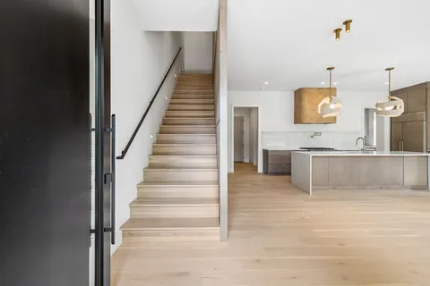 a view of entryway with wooden floor
