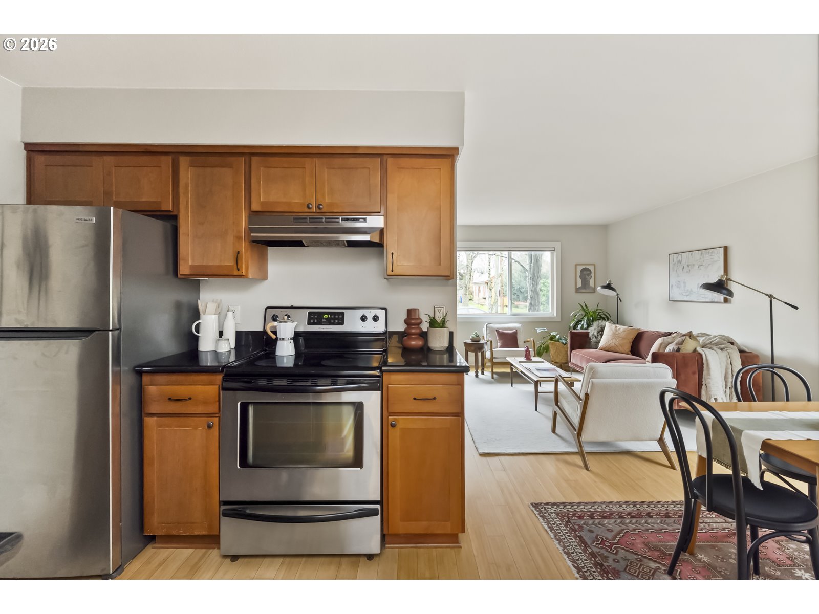2301 Southeast Caruthers Street, Unit 1 Portland, OR 97214 - Photo 8 of 18 a kitchen with a stove and a refrigerator