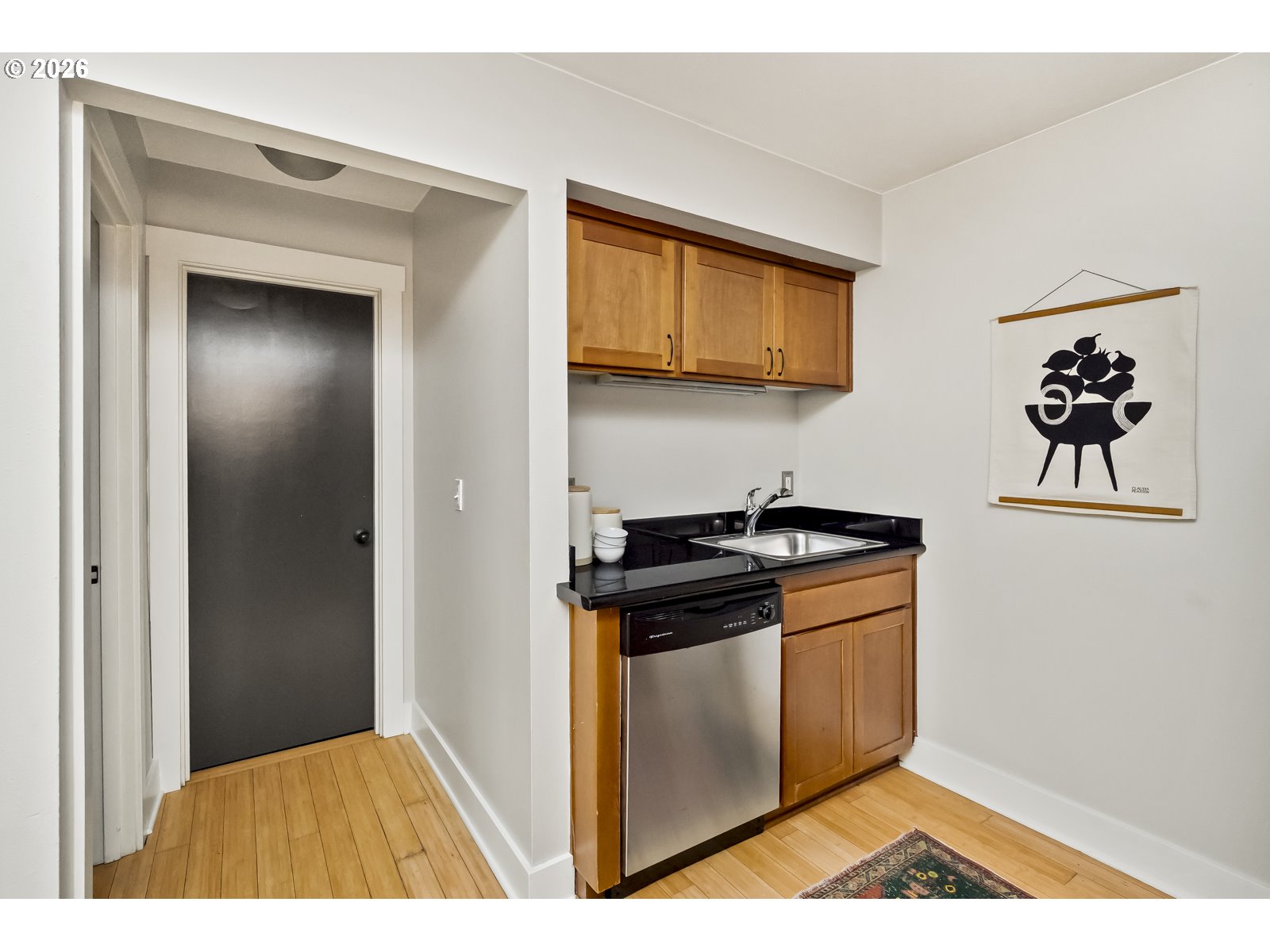 2301 Southeast Caruthers Street, Unit 1 Portland, OR 97214 - Photo 9 of 18 a kitchen with a stove and a microwave