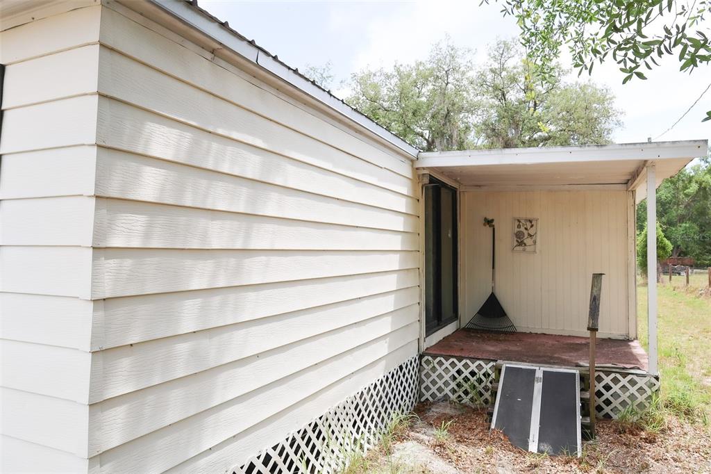 220 King Road Southwest Winter Haven, FL 33880 - Photo 3 of 18 a front view of a house with a yard