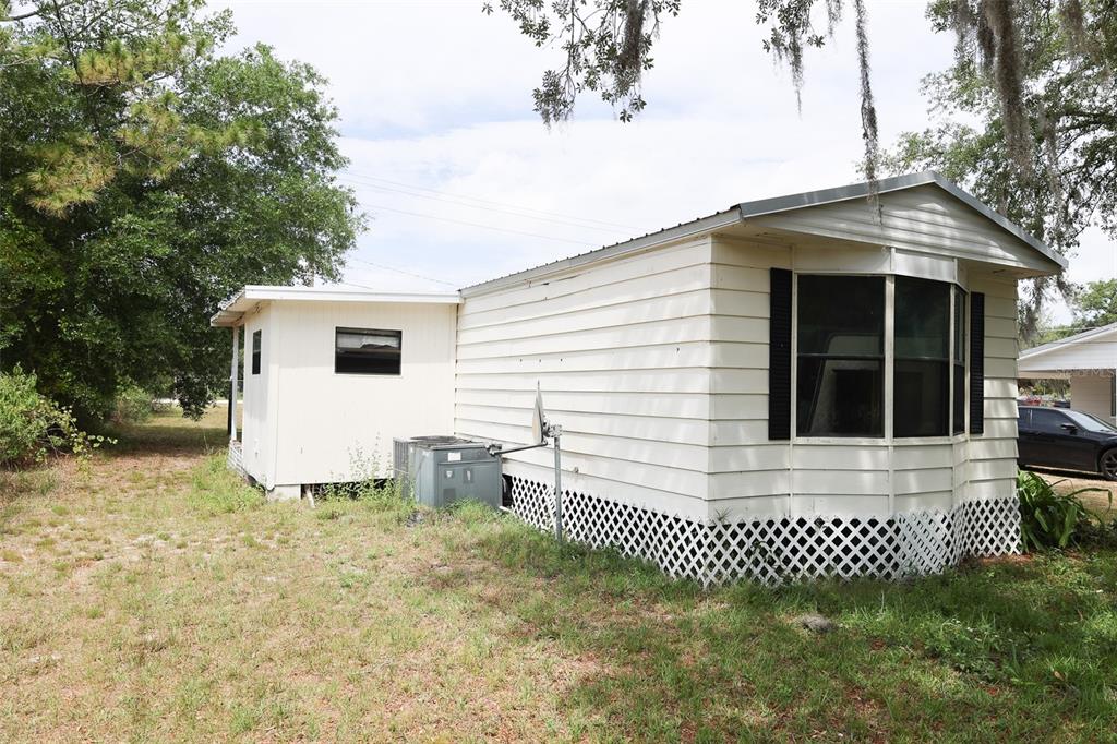 220 King Road Southwest Winter Haven, FL 33880 - Photo 4 of 18 a view of a house with a yard