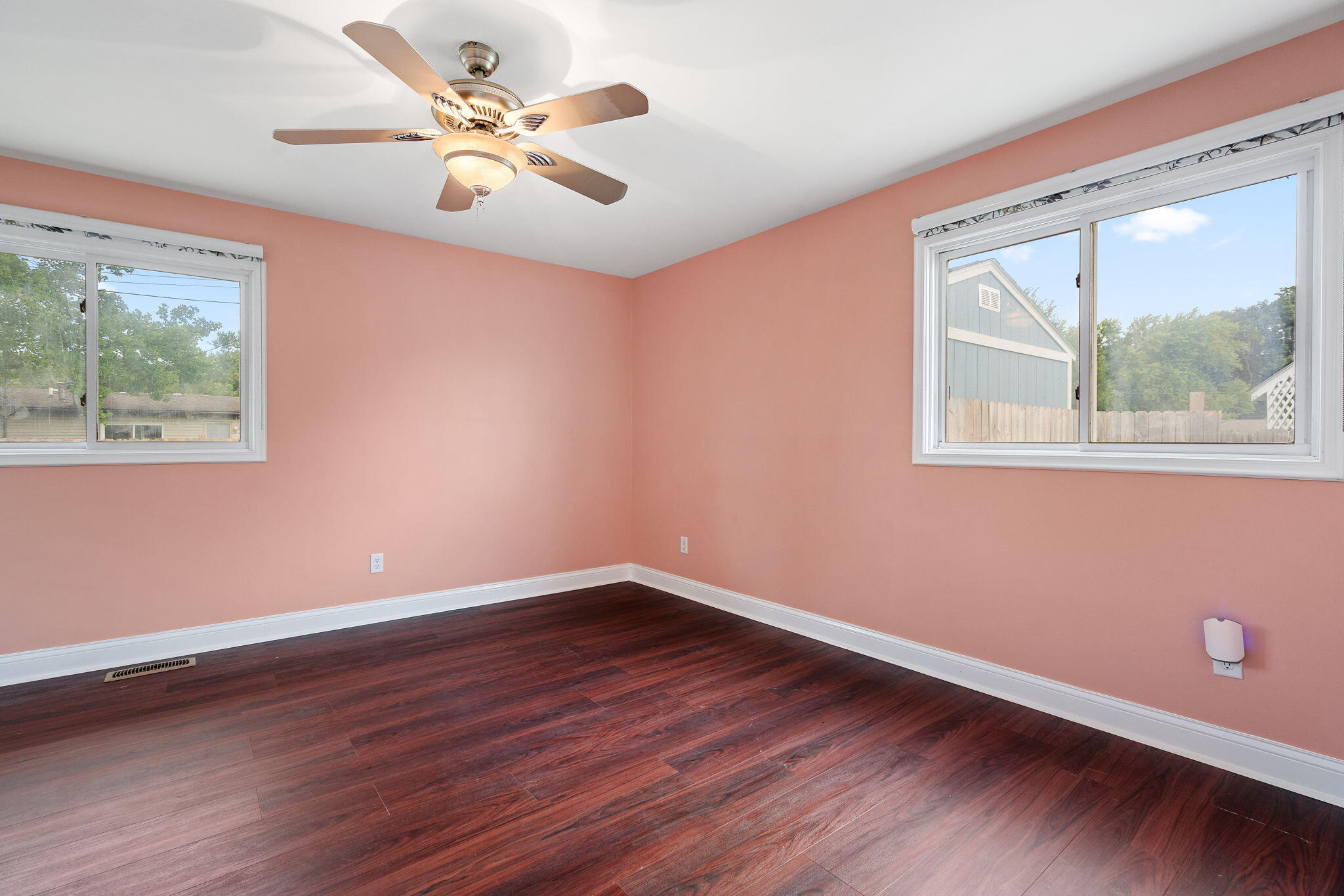 385 Riviera Court Valparaiso, IN 46385 - Photo 17 of 27 a view of an empty room with window and wooden floor