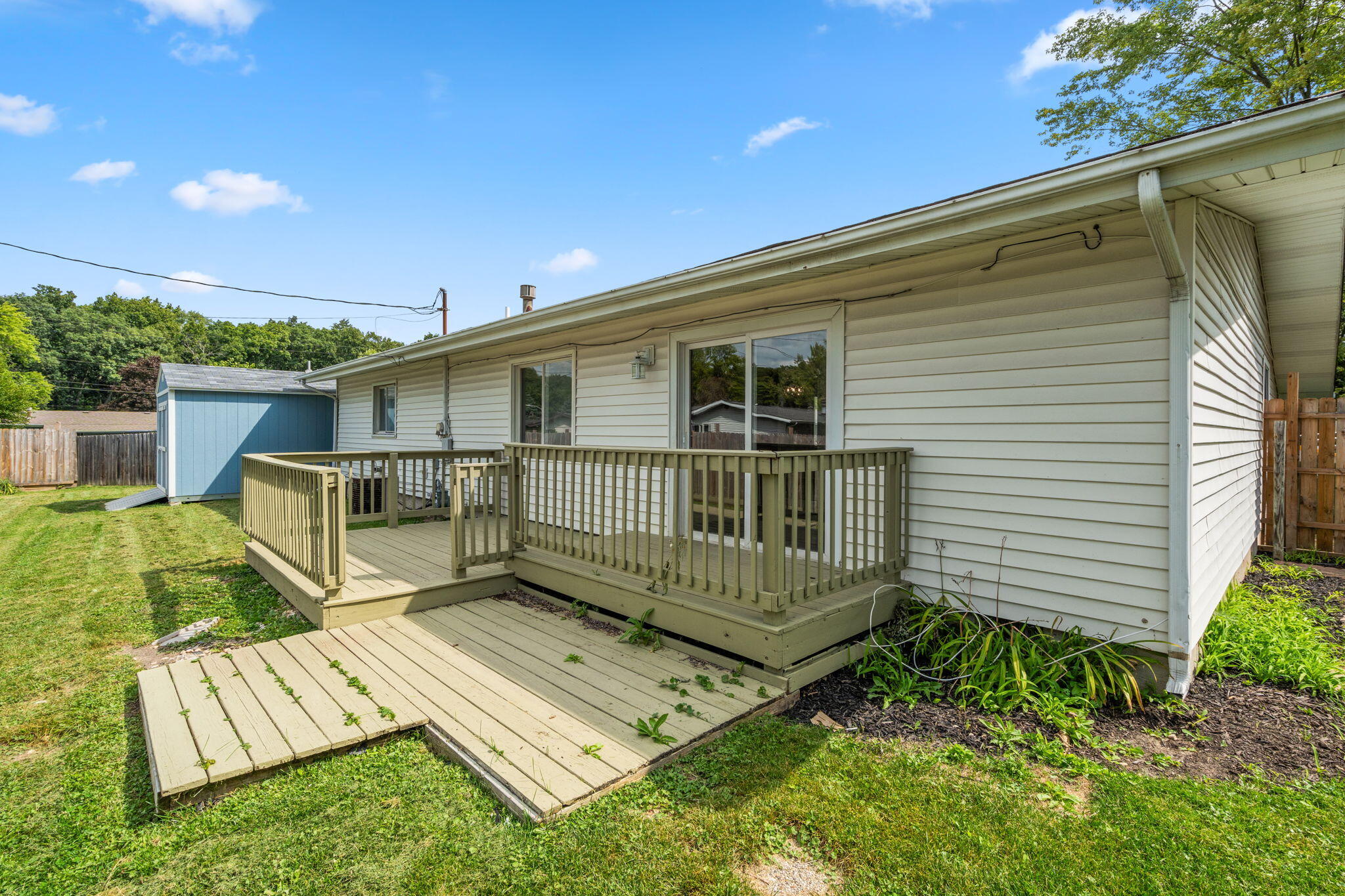 385 Riviera Court Valparaiso, IN 46385 - Photo 21 of 27 a view of a house with backyard and sitting area