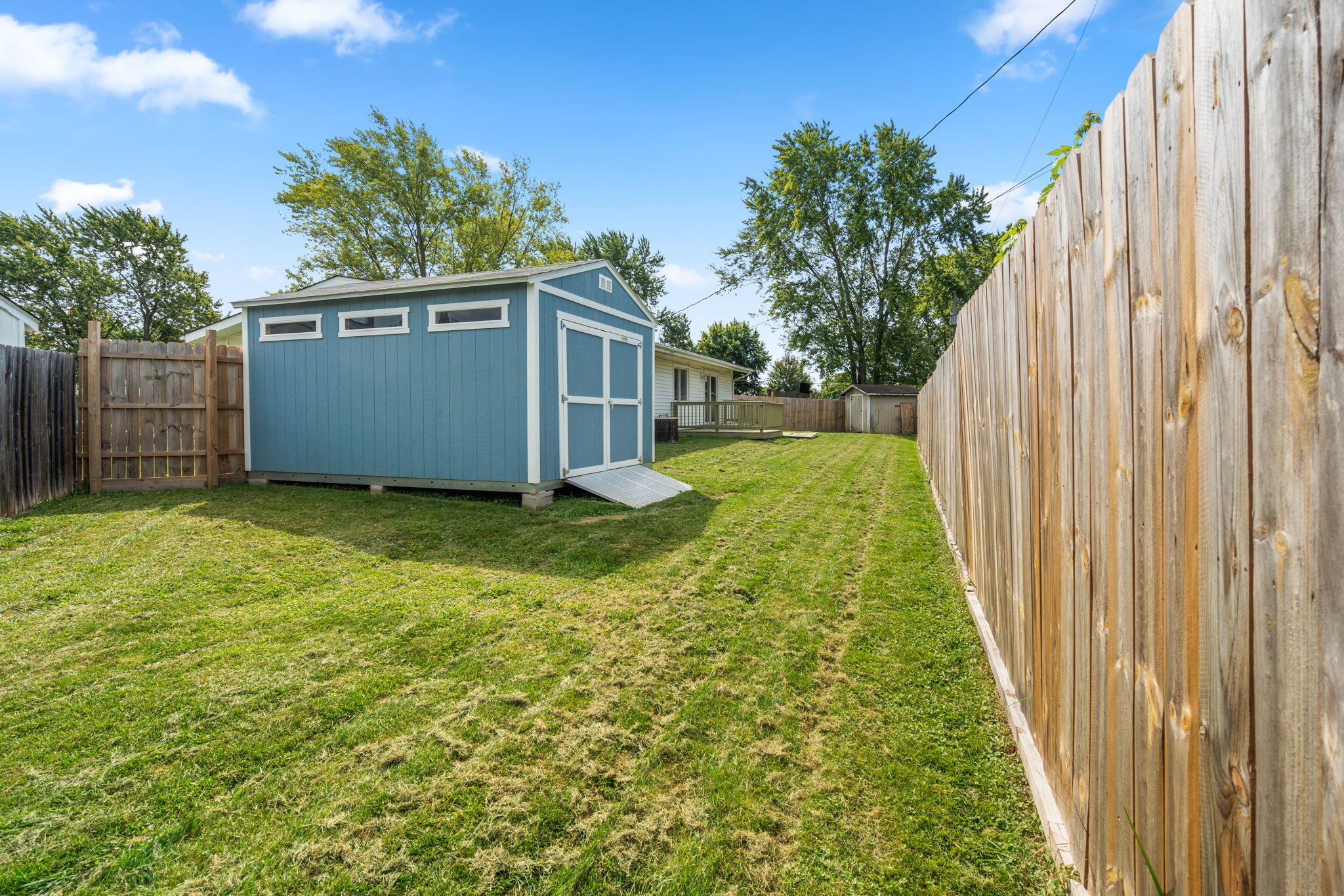 385 Riviera Court Valparaiso, IN 46385 - Photo 23 of 27 a view of a backyard with pathway