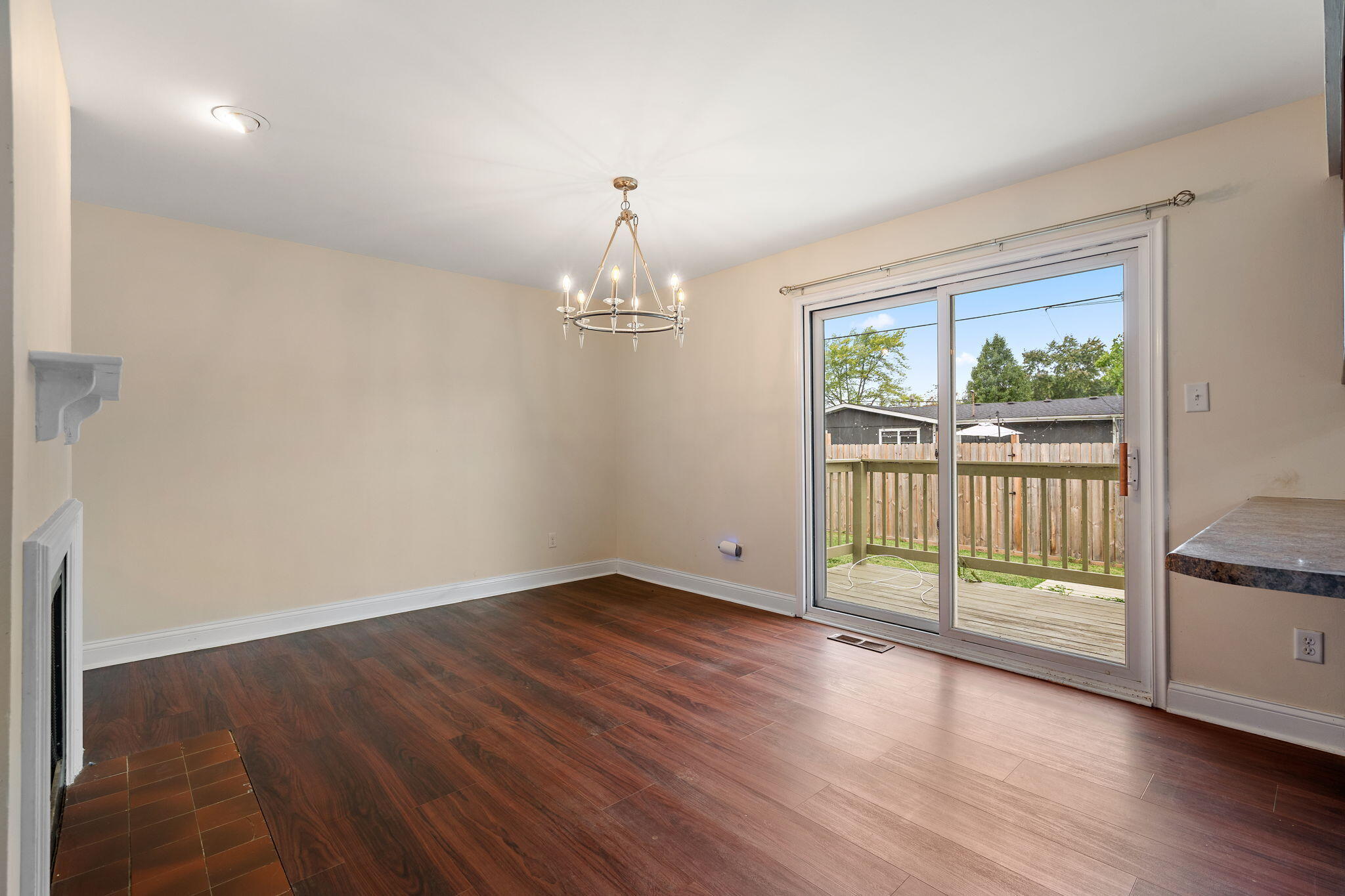 385 Riviera Court Valparaiso, IN 46385 - Photo 9 of 27 a view of an empty room with wooden floor and a window