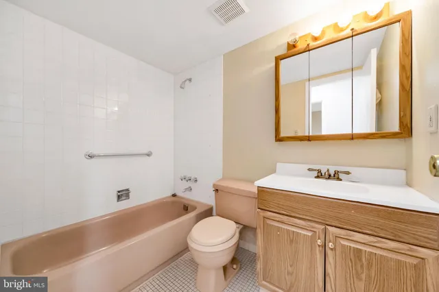 a bathroom with a sink a toilet and a bathtub