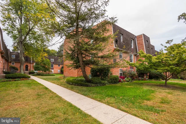 a view of a building with a yard