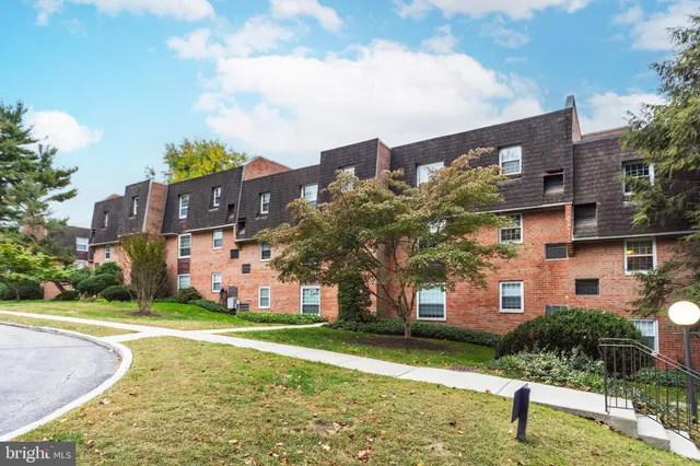 a front view of building with yard