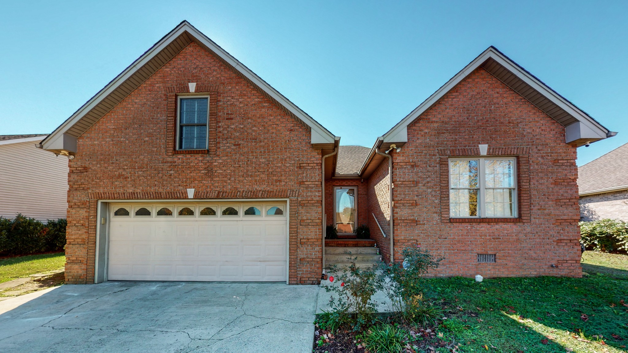 184 Foxrun Springfield, TN 37172 - Photo 2 of 20 a front view of a house with a yard and garage