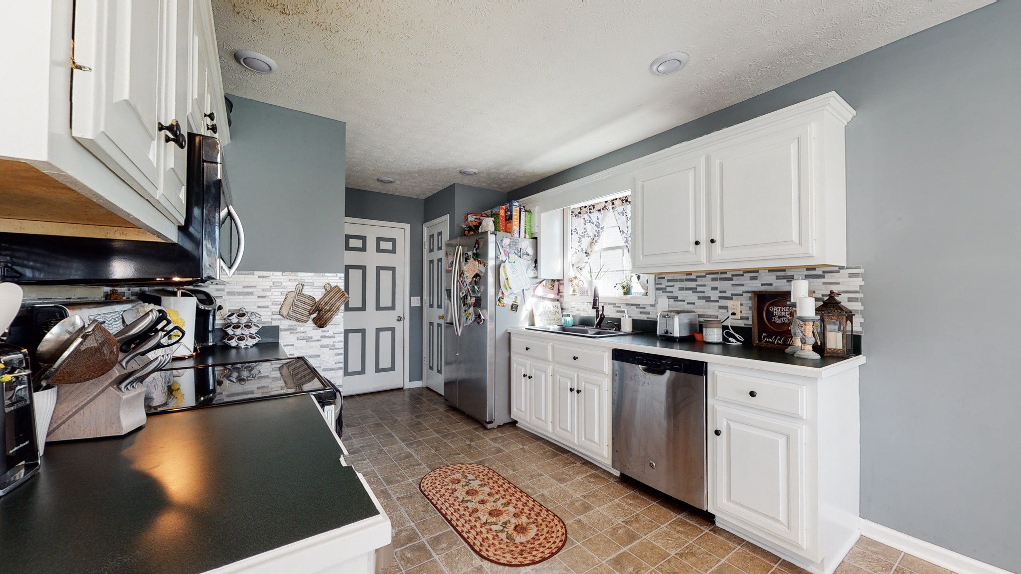 184 Foxrun Springfield, TN 37172 - Photo 12 of 20 a kitchen with stainless steel appliances a stove a sink cabinets and a refrigerator