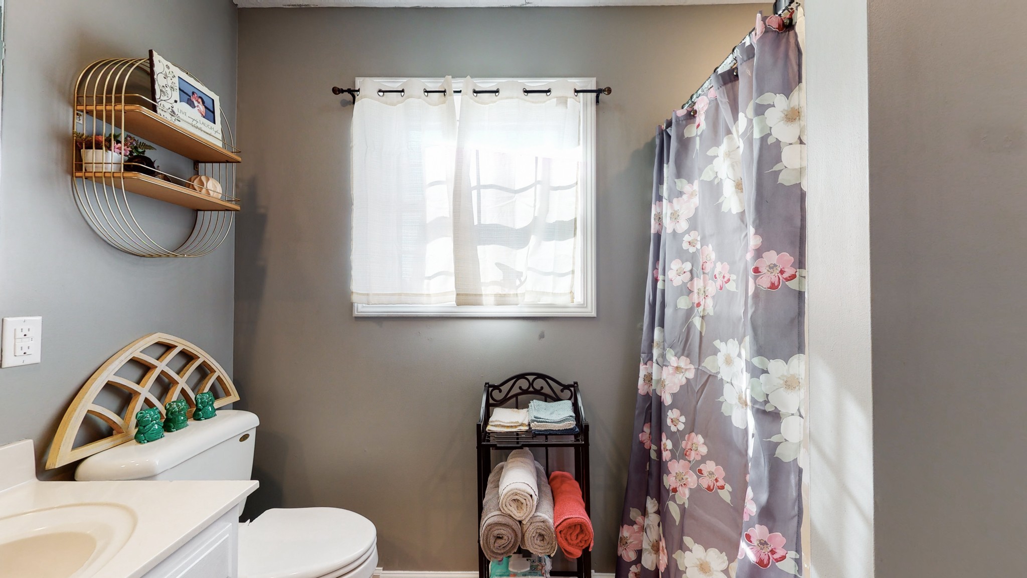 184 Foxrun Springfield, TN 37172 - Photo 15 of 20 a bathroom with a toilet and a shower curtain