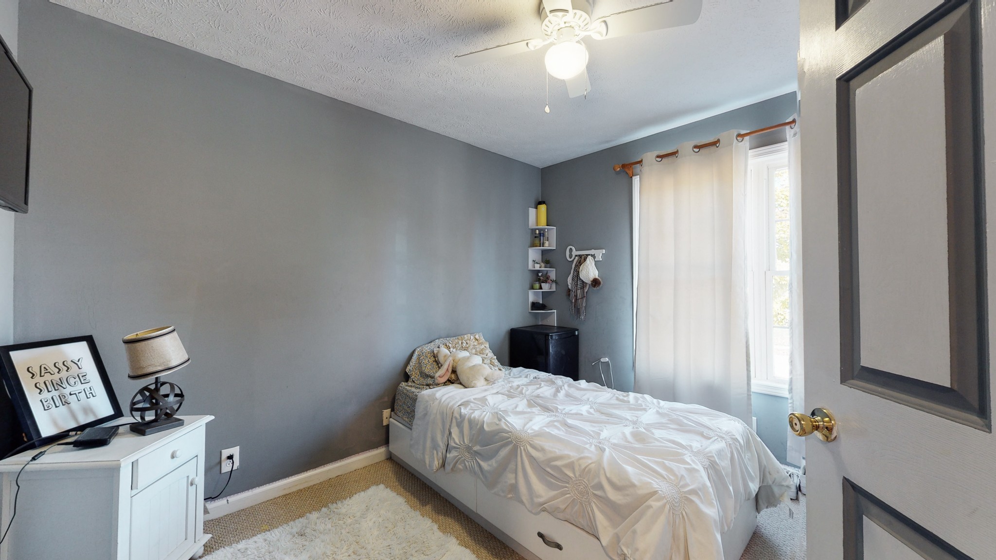 184 Foxrun Springfield, TN 37172 - Photo 16 of 20 a bedroom with a bed and a chandelier