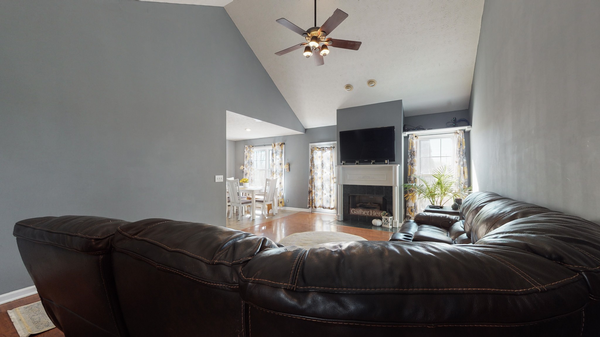 184 Foxrun Springfield, TN 37172 - Photo 4 of 20 a living room with furniture a fireplace and a flat screen tv