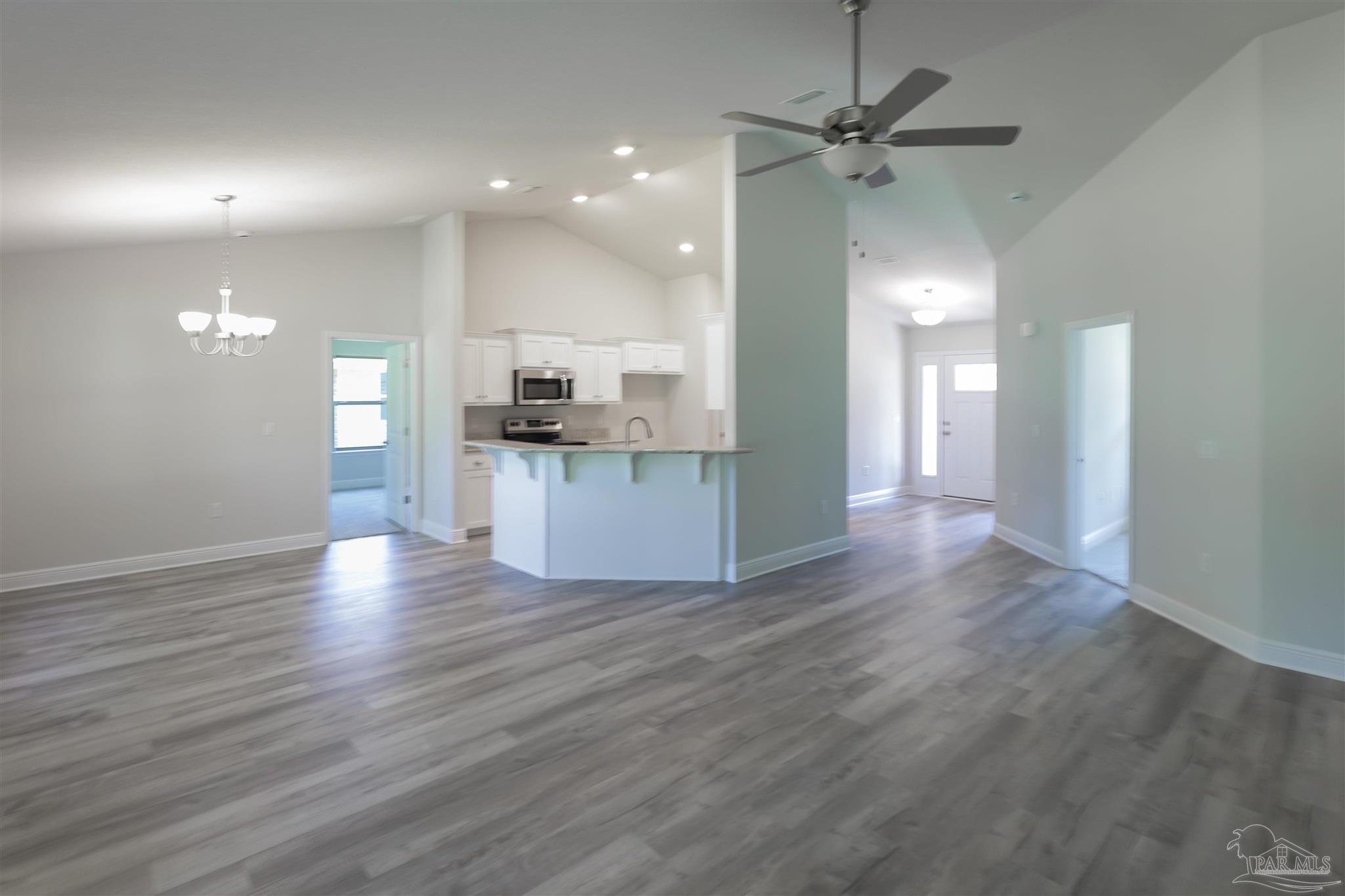 5979 Parsonage Circle Milton, FL 32570 - Photo 12 of 26 a view of kitchen with sink and wooden floor