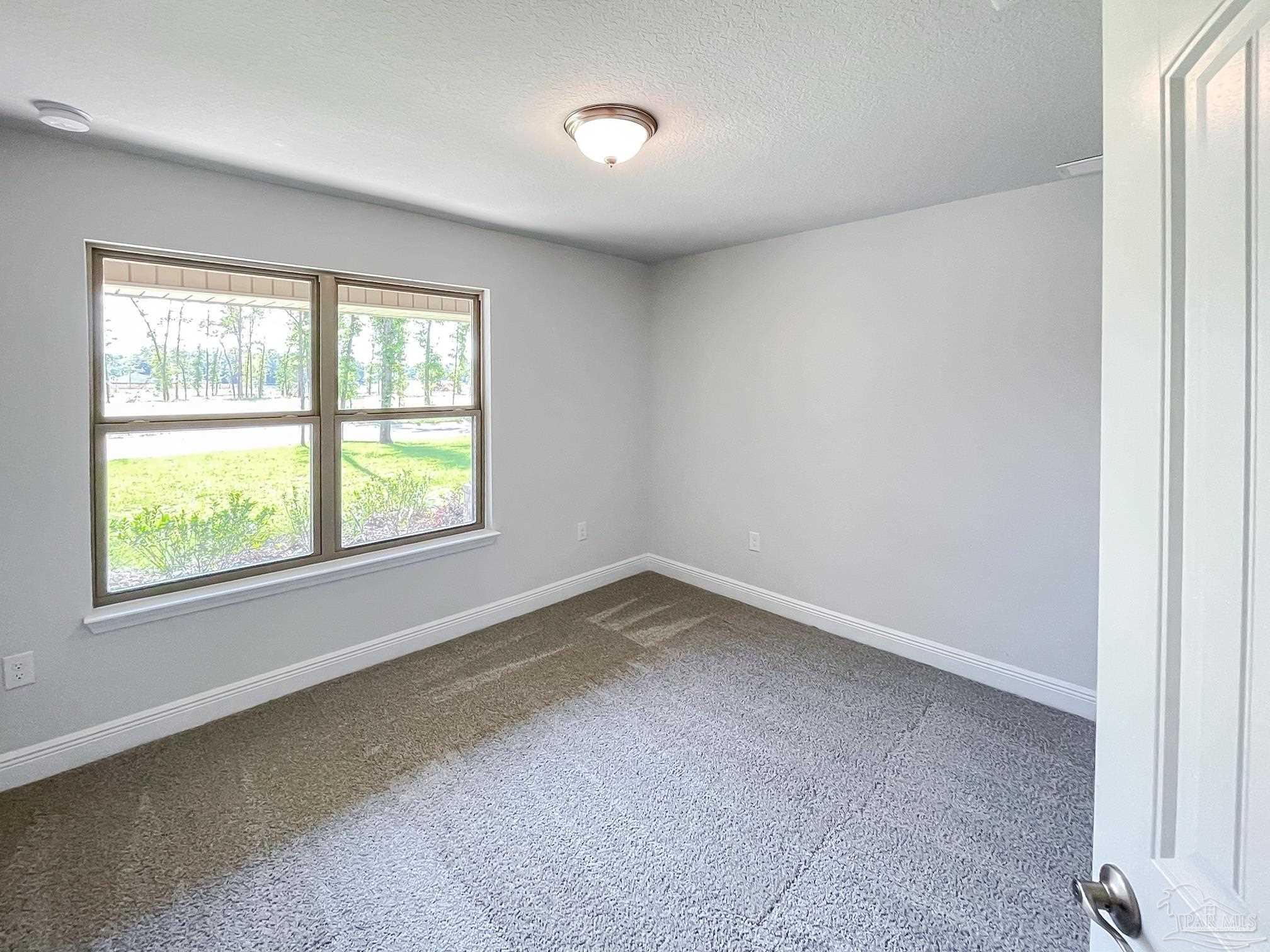 5979 Parsonage Circle Milton, FL 32570 - Photo 23 of 26 an empty room with a window