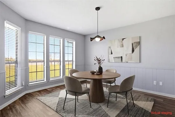 a view of a dining room with furniture window and outside view