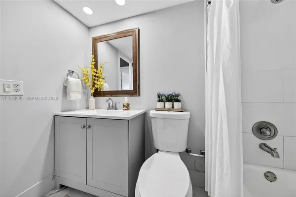 a view of a brick building next to a yard