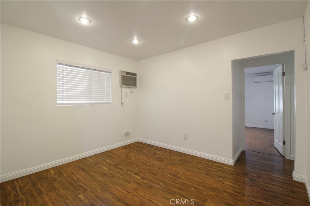 5226 Range View Avenue Los Angeles, CA 90042 - Photo 10 of 16 wooden floor in an empty room with a window