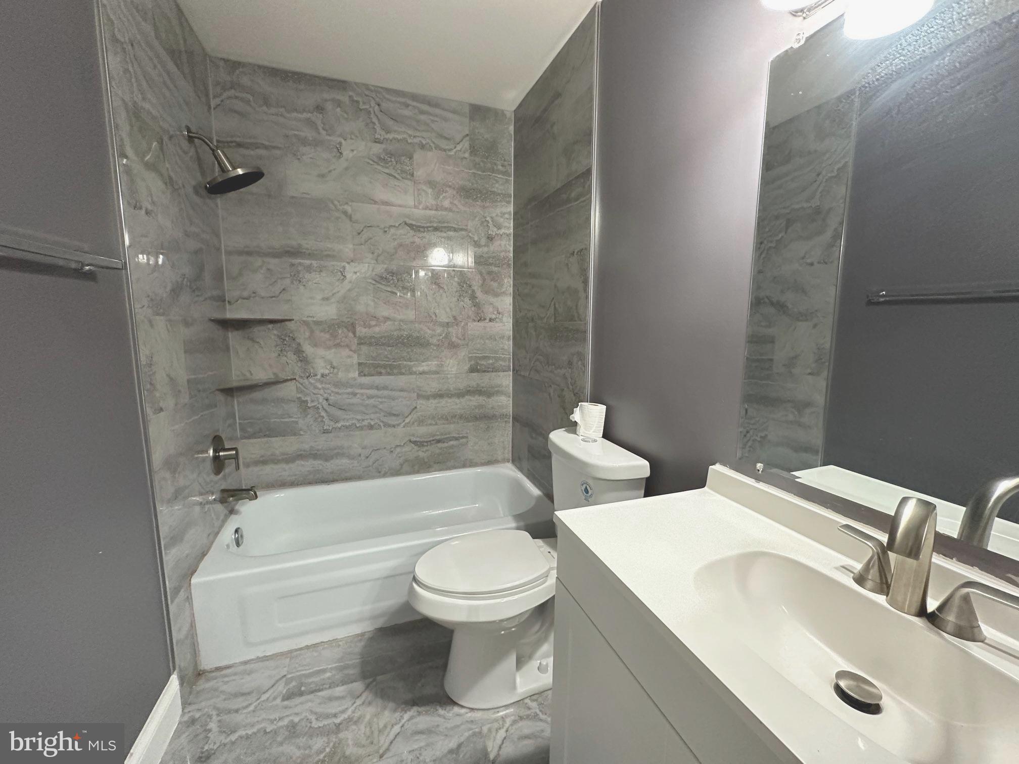 9078 McClellan Common Manassas, VA 20110 - Photo 18 of 25 a bathroom with a sink toilet and shower