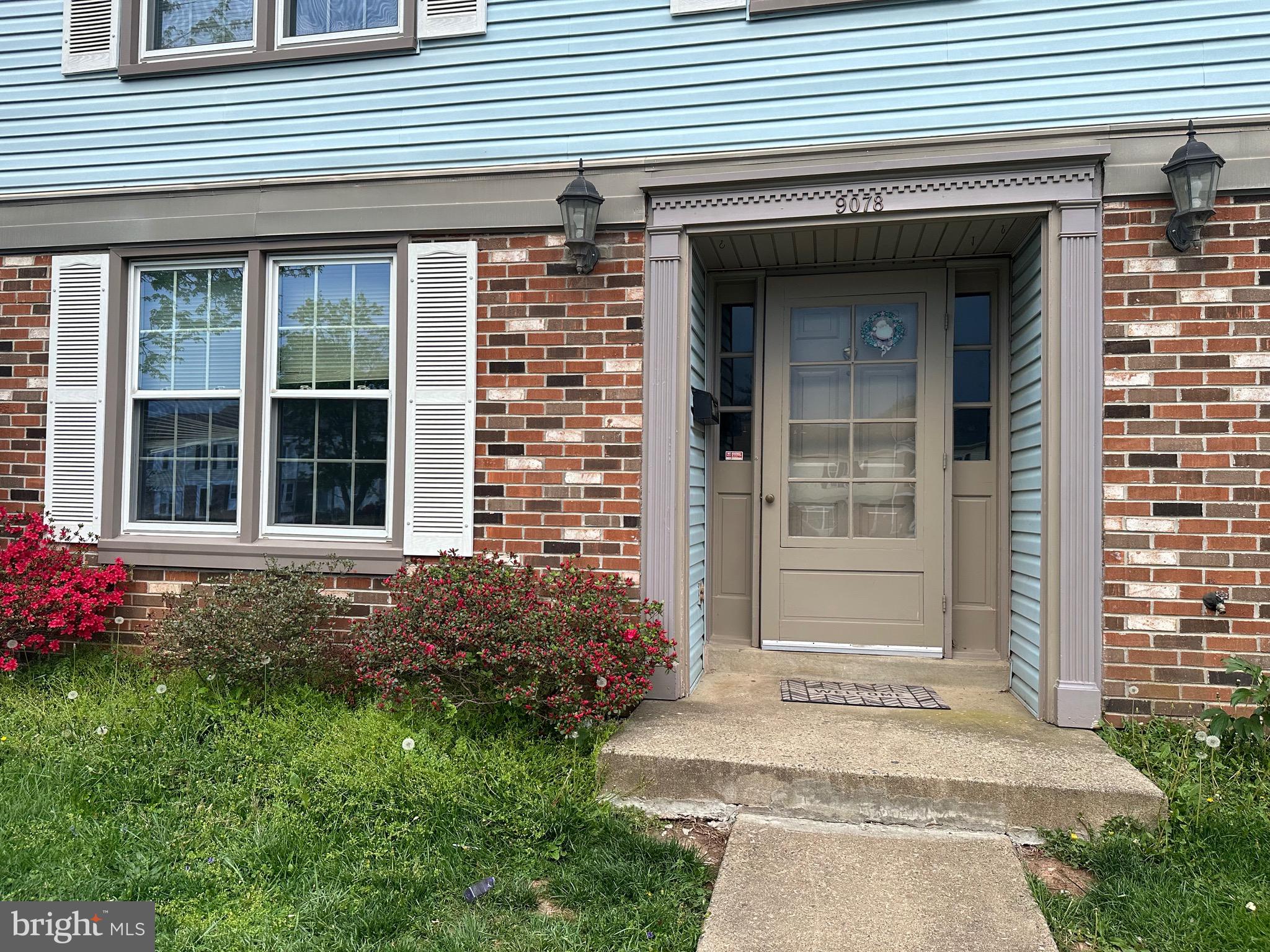 9078 McClellan Common Manassas, VA 20110 - Photo 3 of 25 a front view of a house