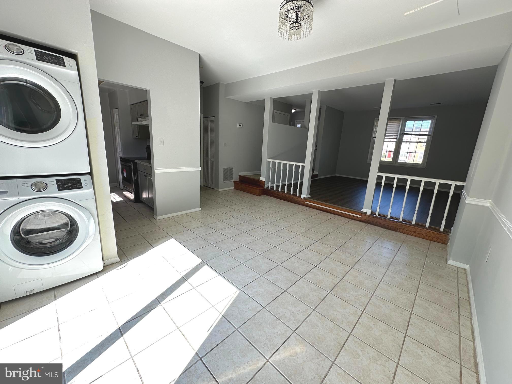 9078 McClellan Common Manassas, VA 20110 - Photo 9 of 25 a view of a hallway with washer and dryer
