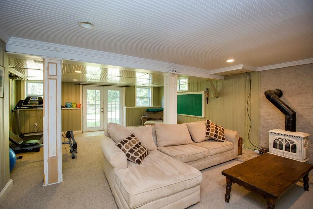 32 Merritt Mountain Road Phippsburg, ME 04562 - Photo 26 of 35 Basement living area with wood...