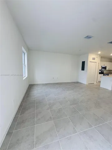 a view of an empty room and window