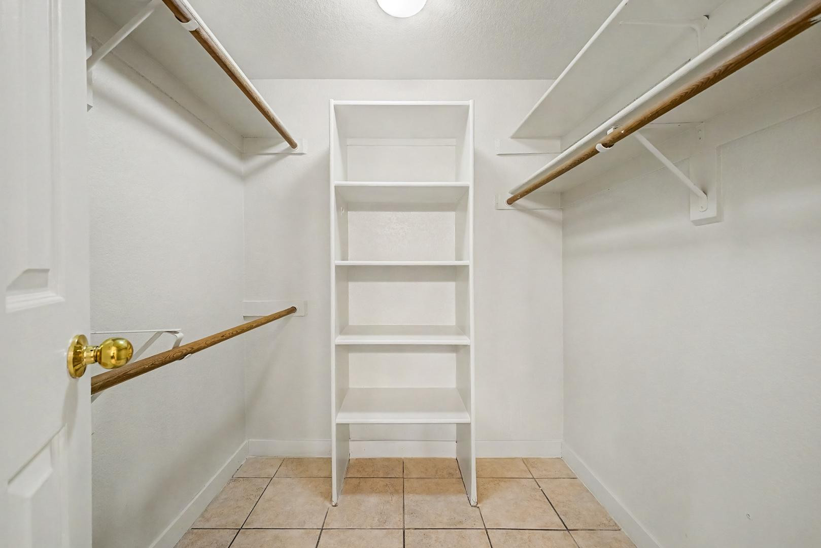 6885 East Cochise Road, Unit 142 Paradise Valley, AZ 85253 - Photo 29 of 47 a view of walk in closet with empty racks