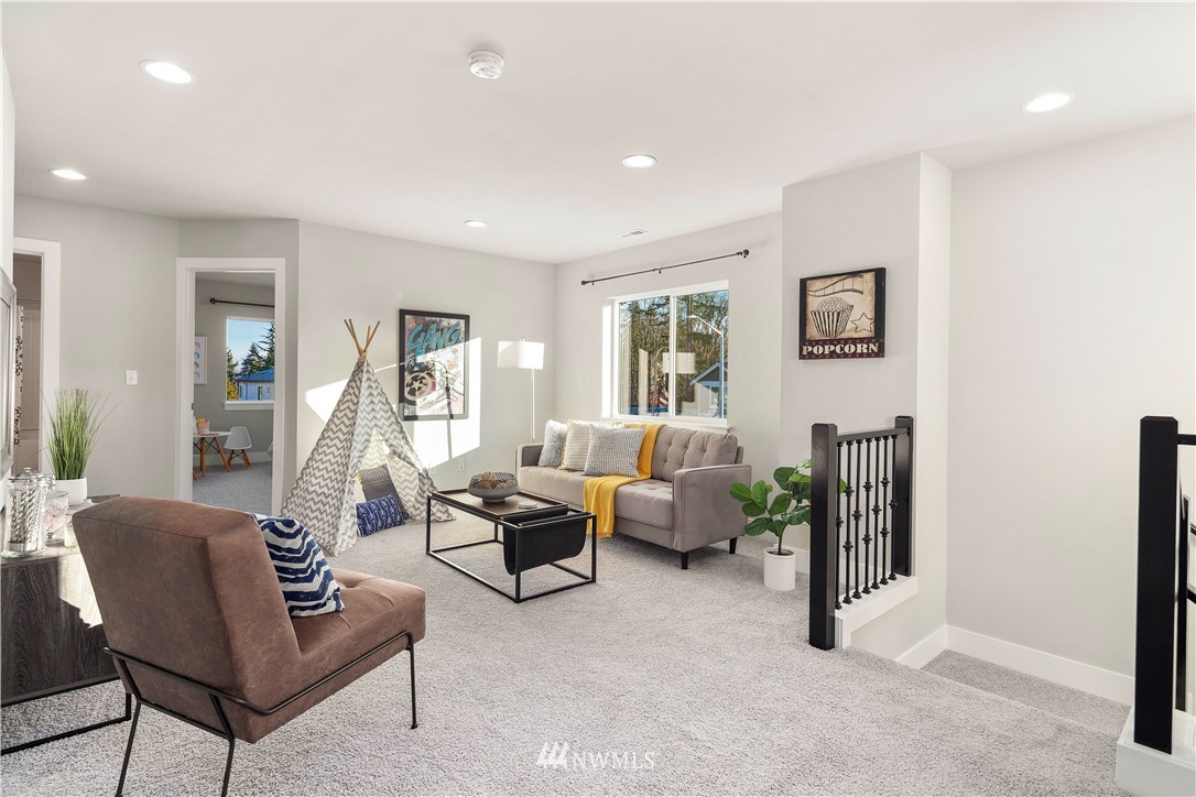 7 176th Place Southeast Bothell, WA 98012 - Photo 20 of 40 a living room with furniture and a large window