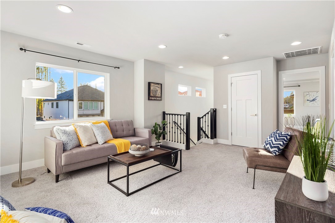 7 176th Place Southeast Bothell, WA 98012 - Photo 21 of 40 a living room with furniture and wooden floor